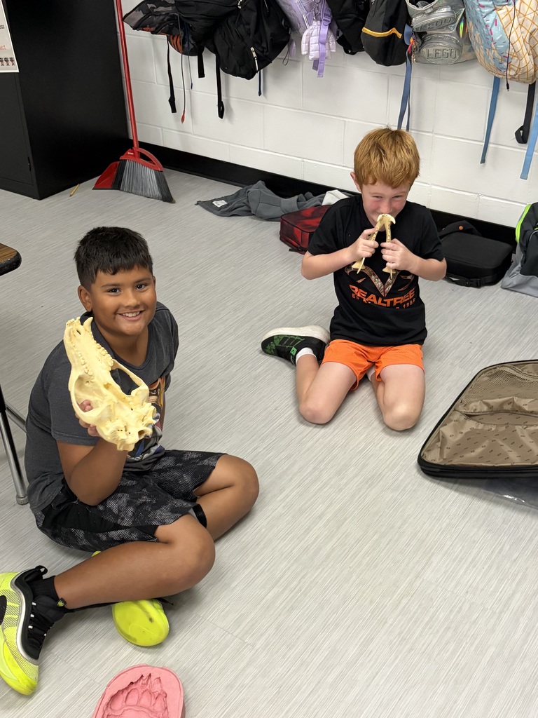 group of students exploring Lewis and Clark artifacts