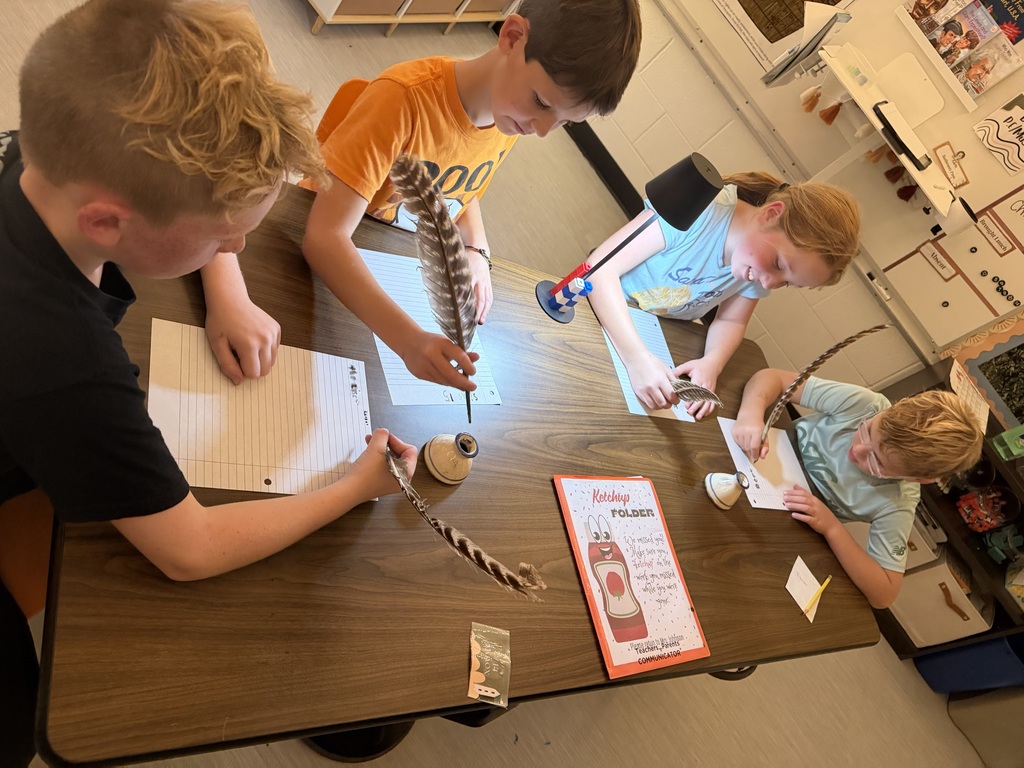 group of students writing with quills used on the Lewis and Clark expedition