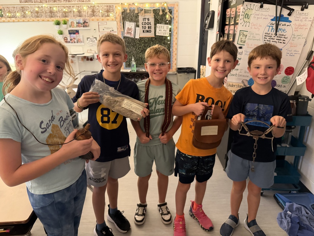 group of students exploring Lewis and Clark artifacts