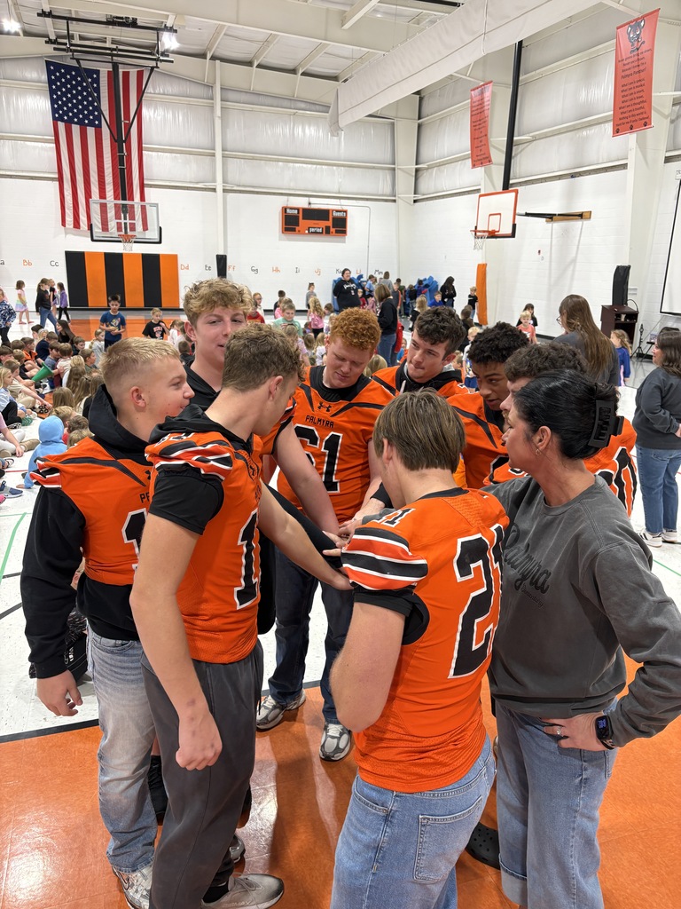 high school football players in huddle
