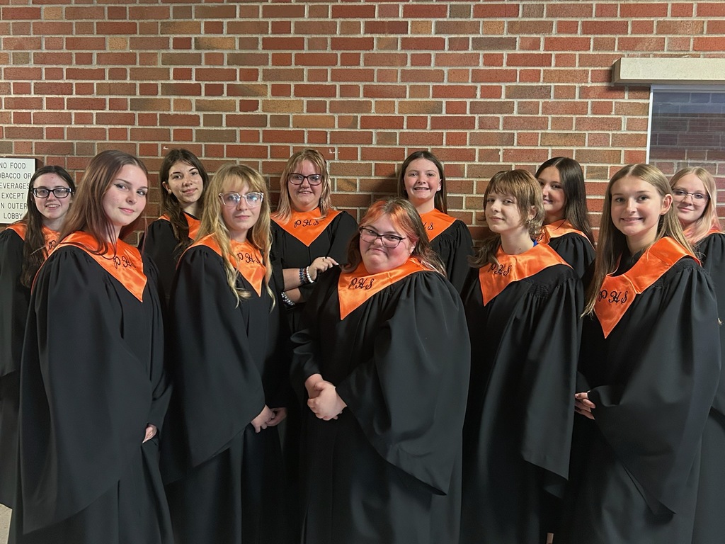 PHS Choir in black robes and orange scarfs
