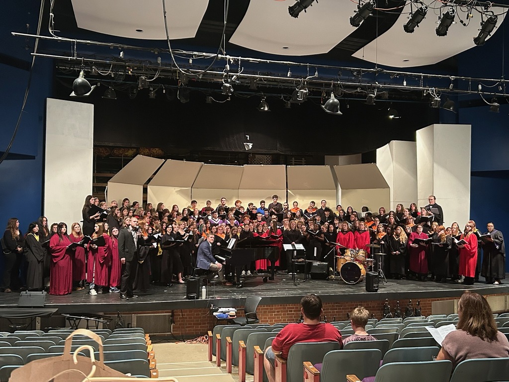 Choirs performing on stage at Culver Stockton College
