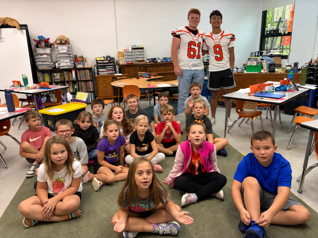 classroom students with 2 football players