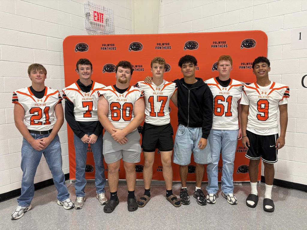 football players in the gym for morning assembly