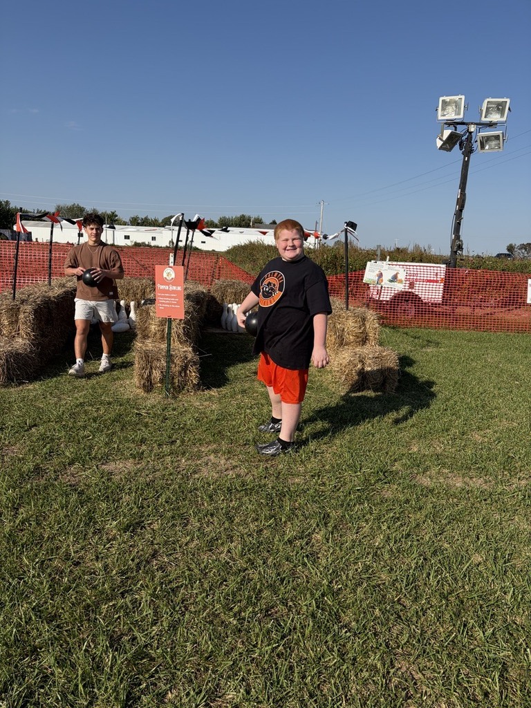 student on field trip at pumpkin patch