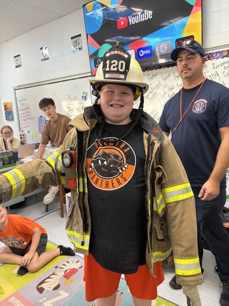students dressed in fire gear