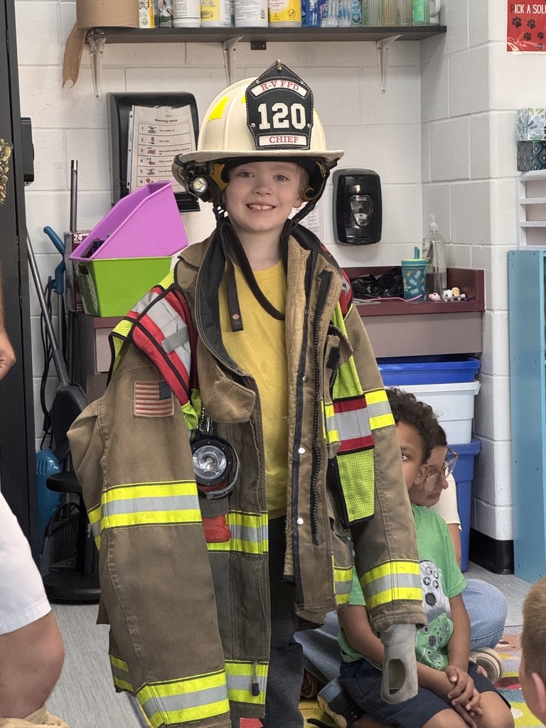 students dressed in fire gear