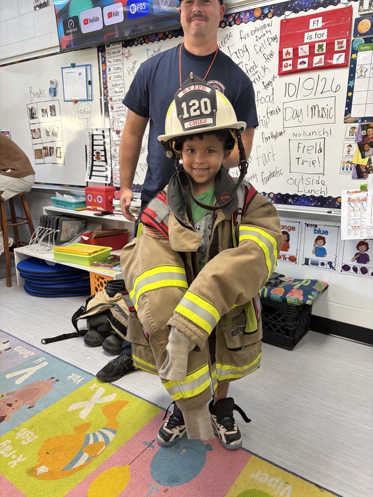 students dressed in fire gear
