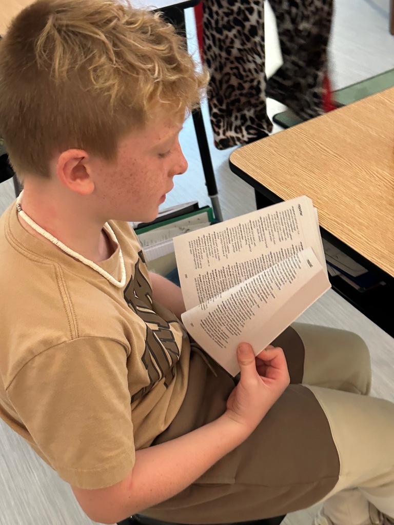 student using dictionary from Kiwanis club