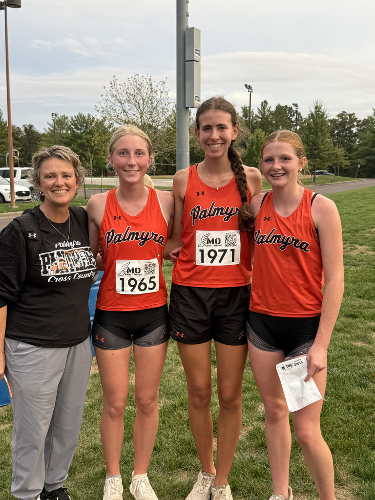 girls XC team and coach after race