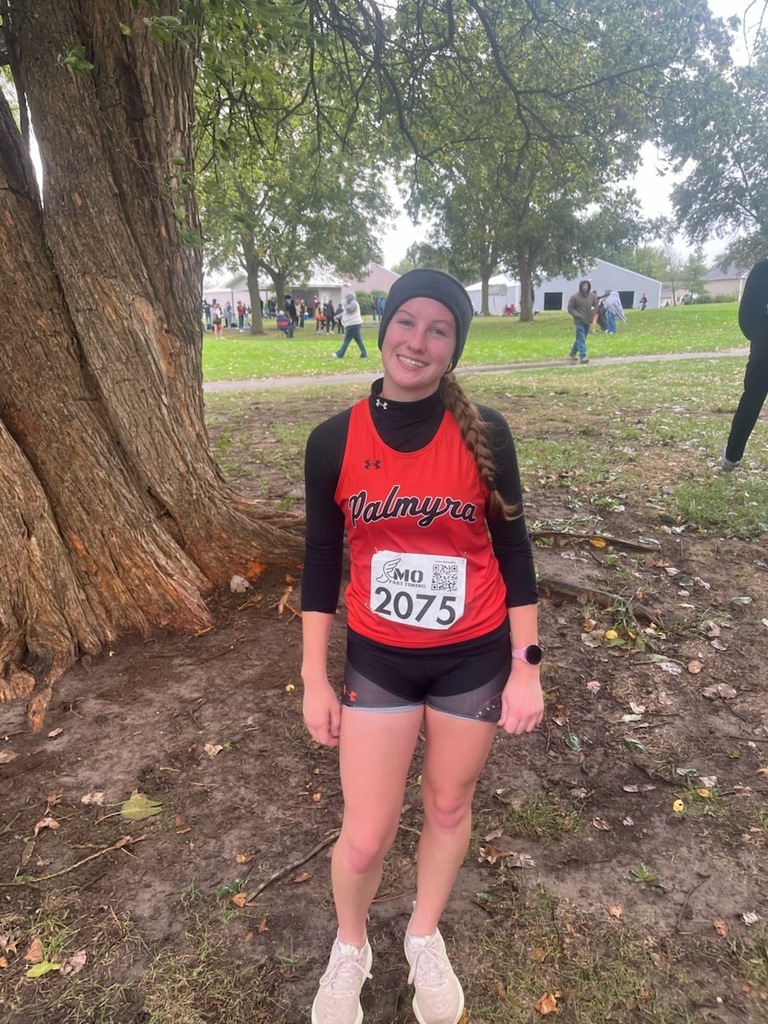 XC runner set new record standing by tree