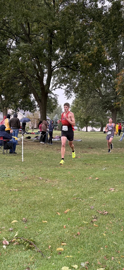 xc runner running towards finish line