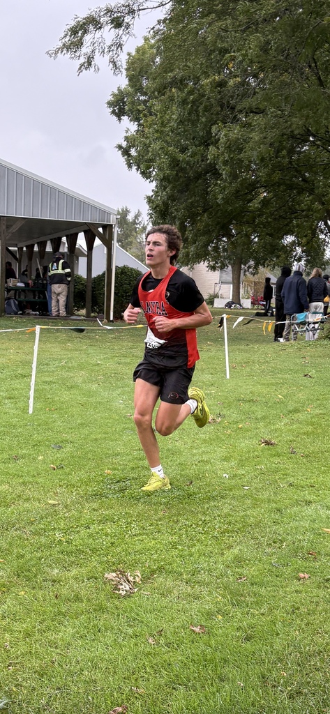 xc runner running towards finish line