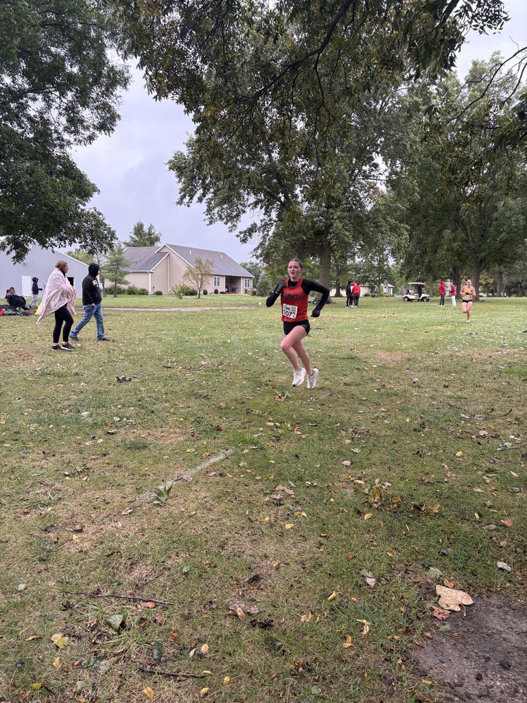 xc runner running towards finish line