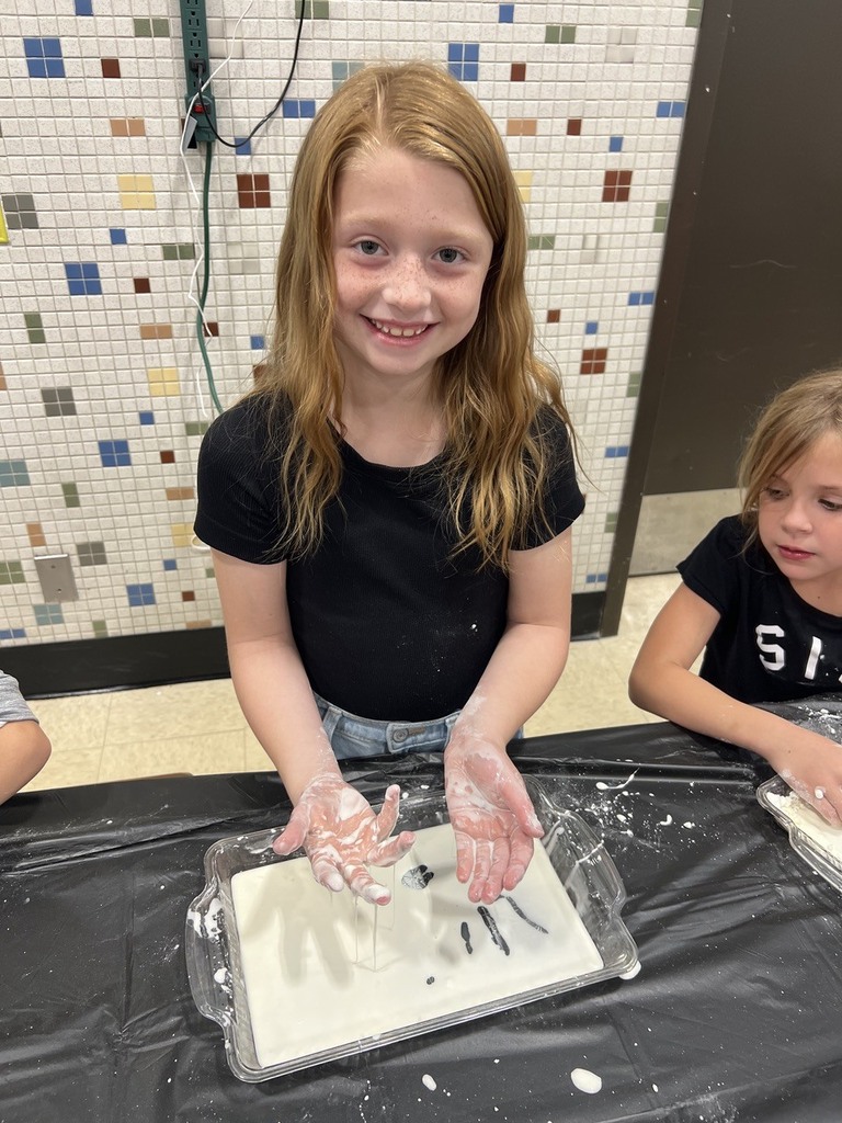 2nd grade students making oobleck in cafeteria
