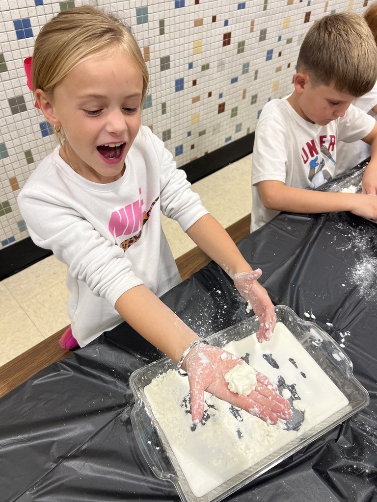 2nd grade students making oobleck in cafeteria