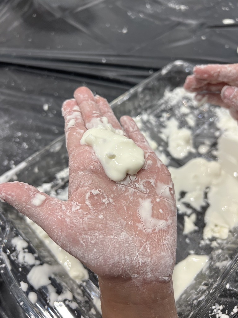 2nd grade students making oobleck in cafeteria