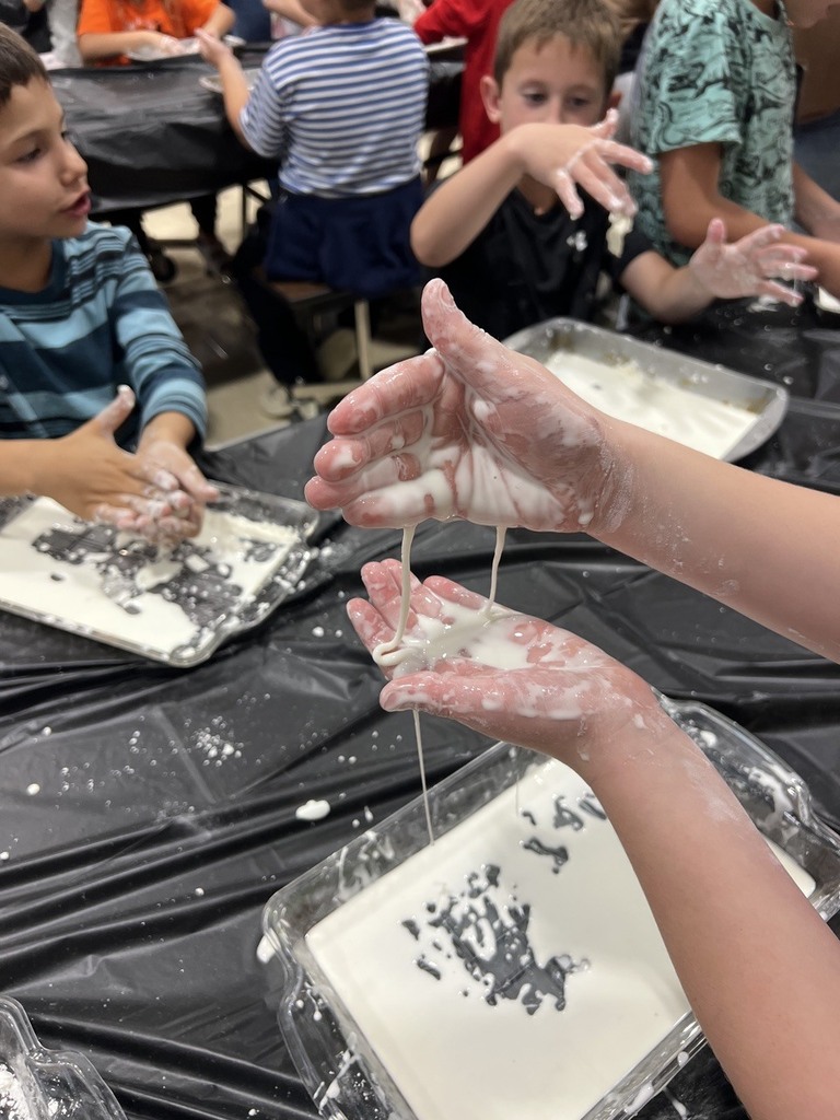 2nd grade students making oobleck in cafeteria