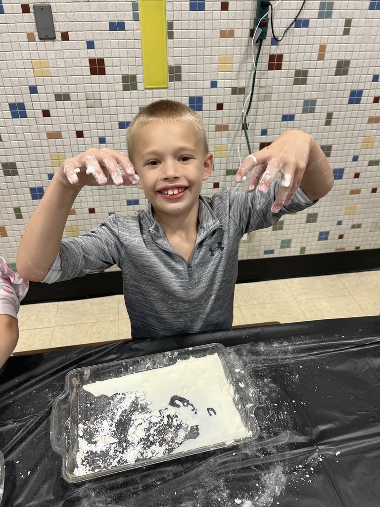 2nd grade students making oobleck in cafeteria