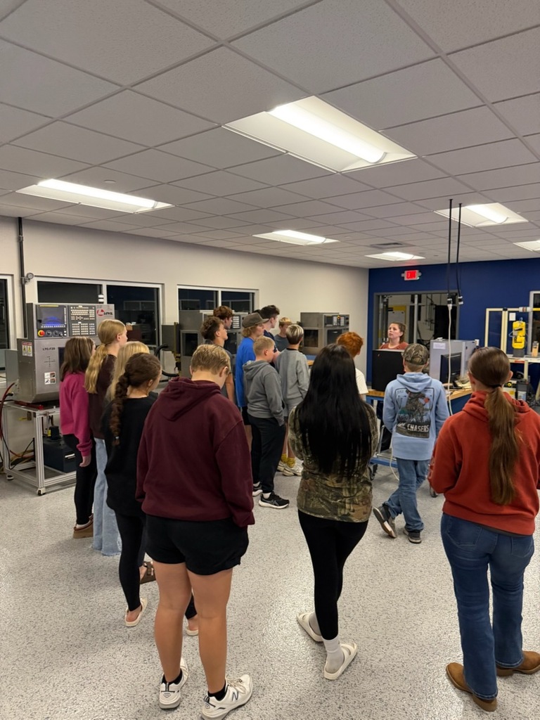Middle School students listen to instructor speak on tour