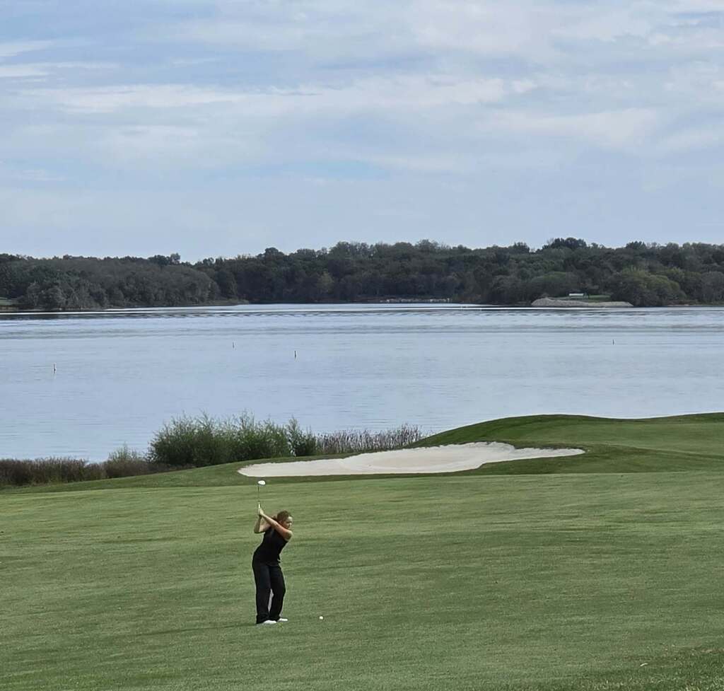 golfer driving the ball