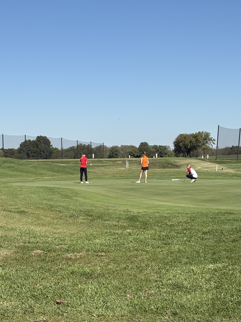 golfers looking at ball position