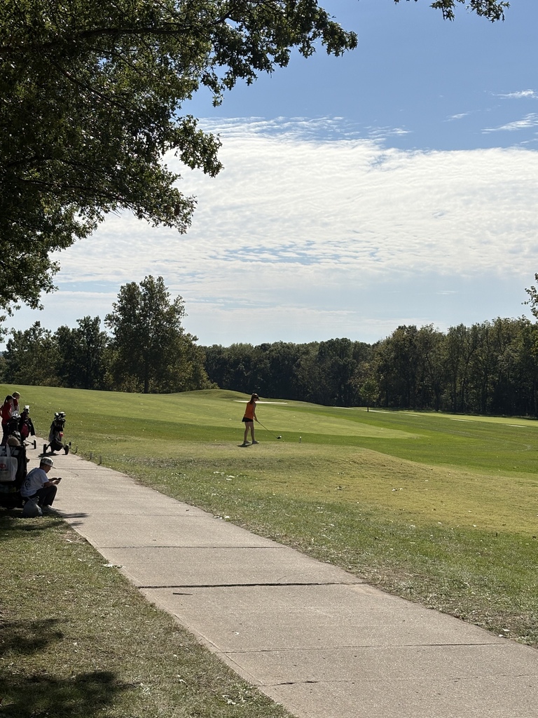 golfer looking at ball position