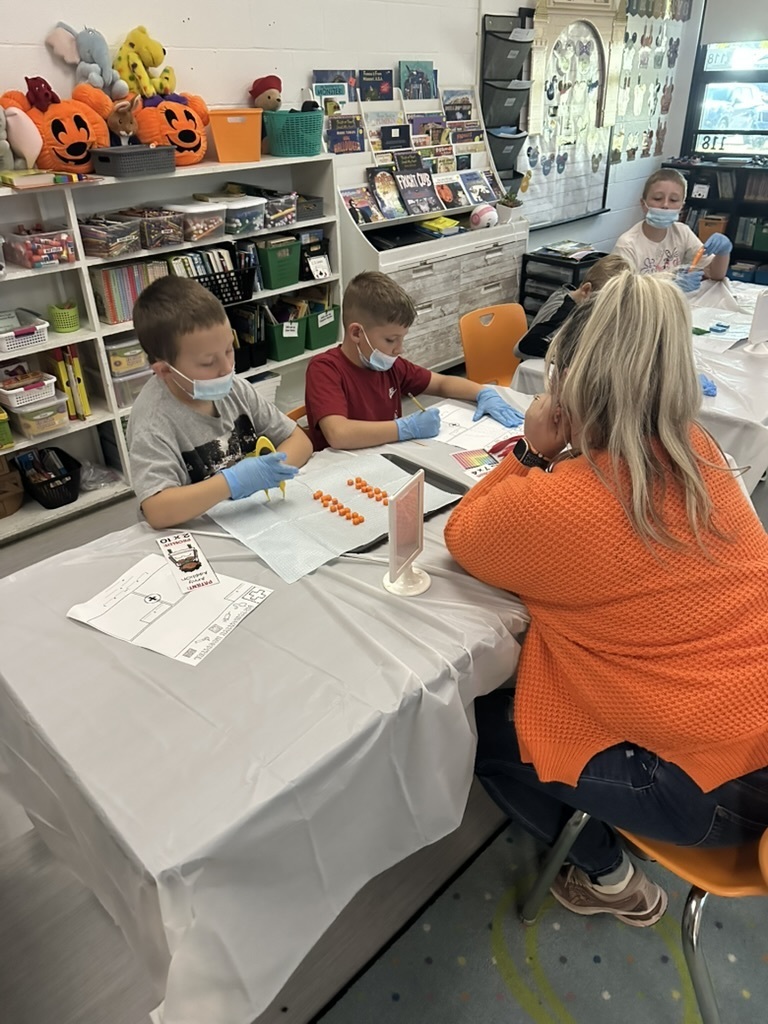 students doing pretend surgery using multiplication