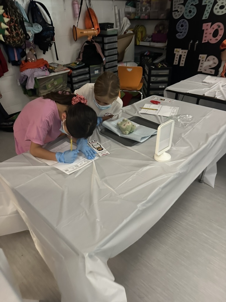 students doing pretend surgery using multiplication