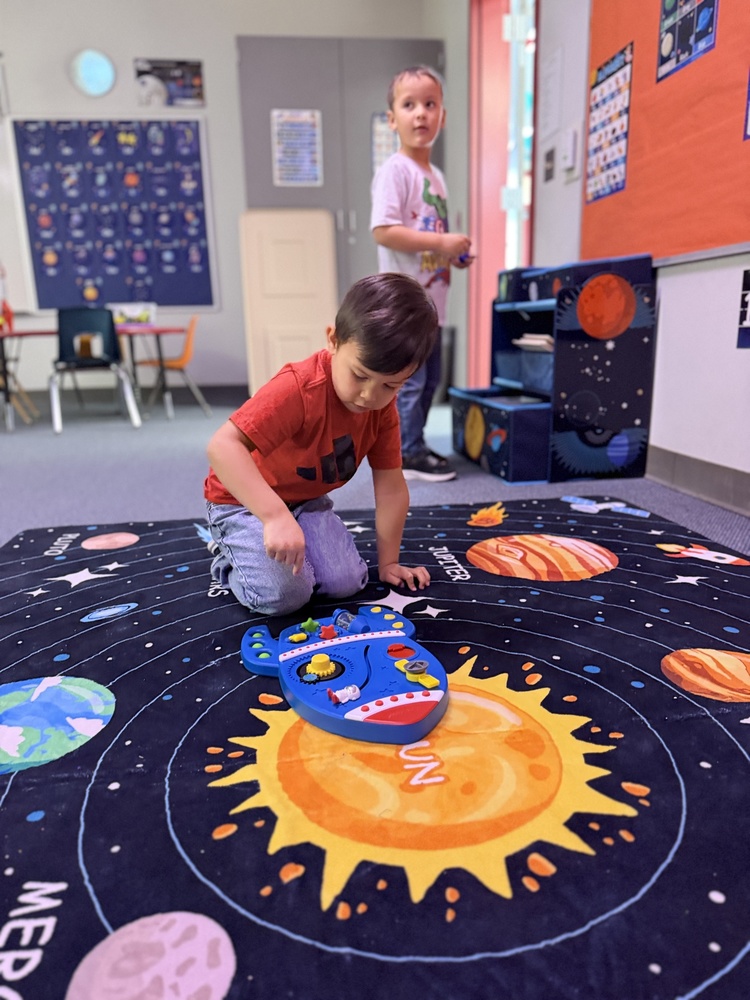 student play with space ship game in the new Wilson Elementary Science Learning Classroom