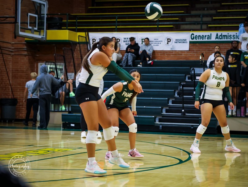 Olivia Owens digs on the ball