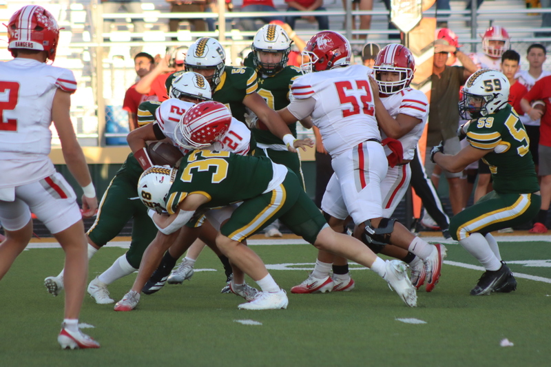 Dase Scott (32) makes the tackle for the Harvesters