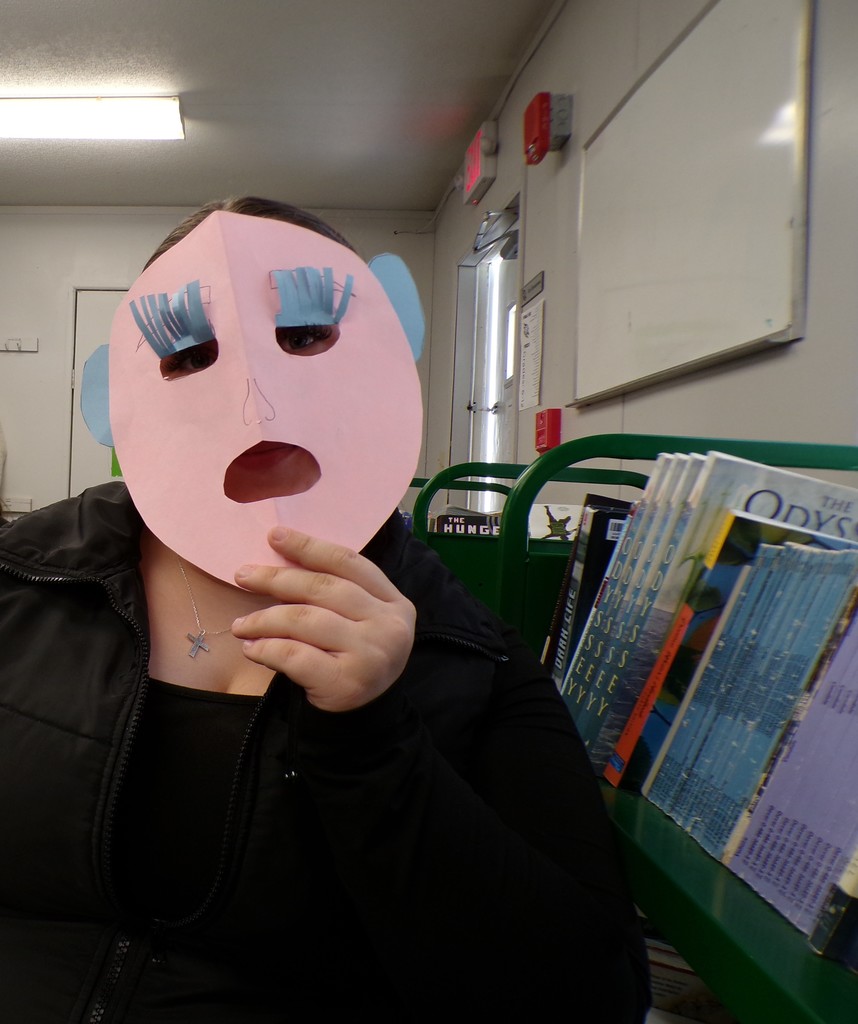 A student models her specific mask.