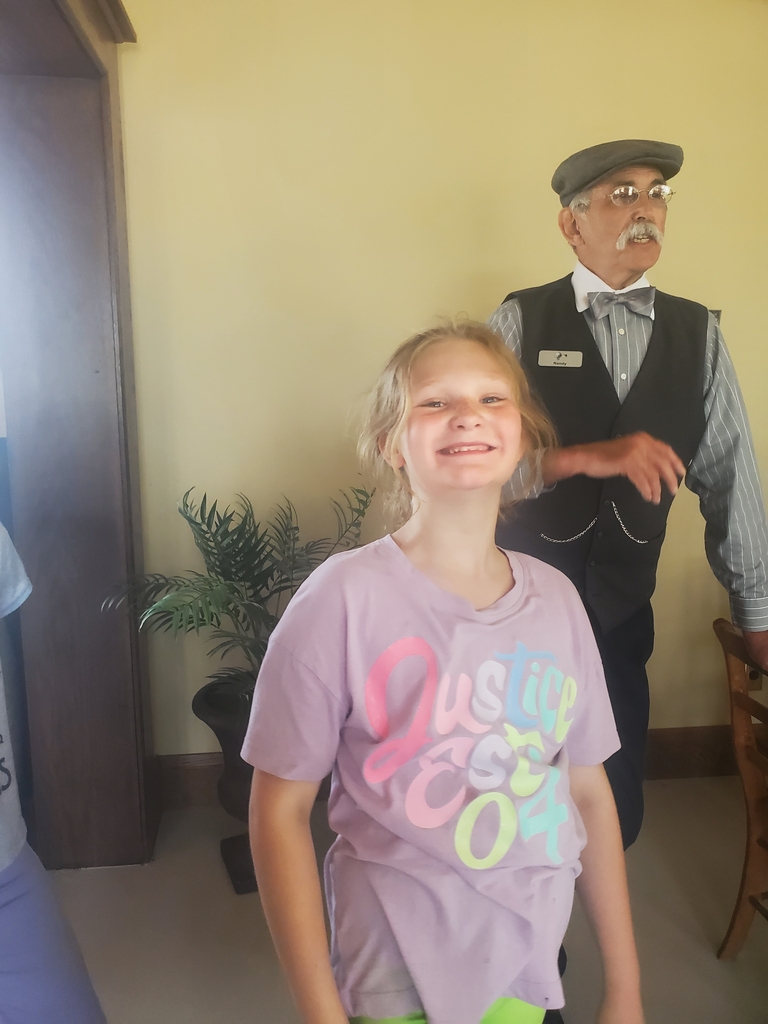 Students enjoyed visiting a replica Ford auto shop from the early 1900s. While they were at Ford, they could speak to an employee to learn more about that time period.