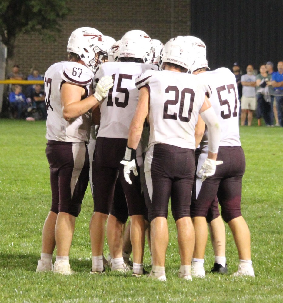 The Warriors huddle up for a play.