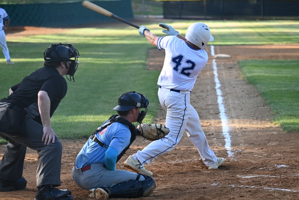 Andy Knapp takes a big cut at a pitch in Sunday night's South Central League home game against the league-leading Yankton Lakers.