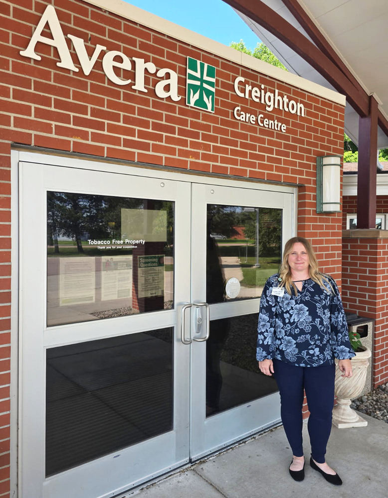 Heather Stacken outside the doors to Avera Creighton Care Center where she was just named Administrator.