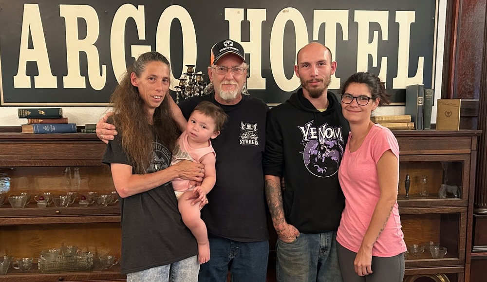 New staff of the Argo Hotel: Esther Fischer, manager; Todd Fischer, co-owner; Darrian Enger, kitchen manager; Esther Enger ; Rhylie Enger held by Esther Fischer (Not pictured: Chuck Mitzel, Jr., co-owner)