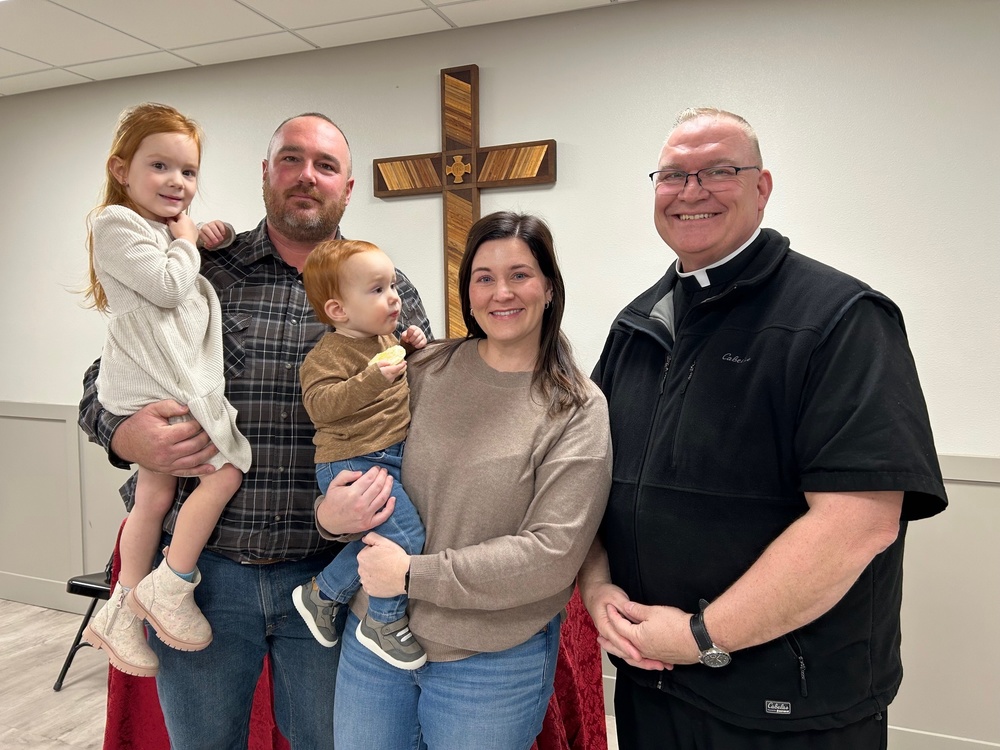 The family of Brian and April Sudbeck and children Rosie and Jack were part of a long line of those showing appreciation and wishing well to Father Jim Keiter at a farewell held at the St. John Parish Hall on Sunday, December 21.