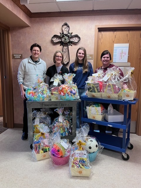 Brooklyn with Modern Woodmen Representative Quinton and nurses at Sacred Heart Hospital