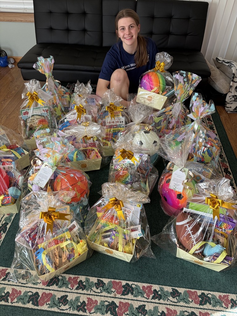 Brooklyn with her 18 gift baskets she and project volunteers assembled