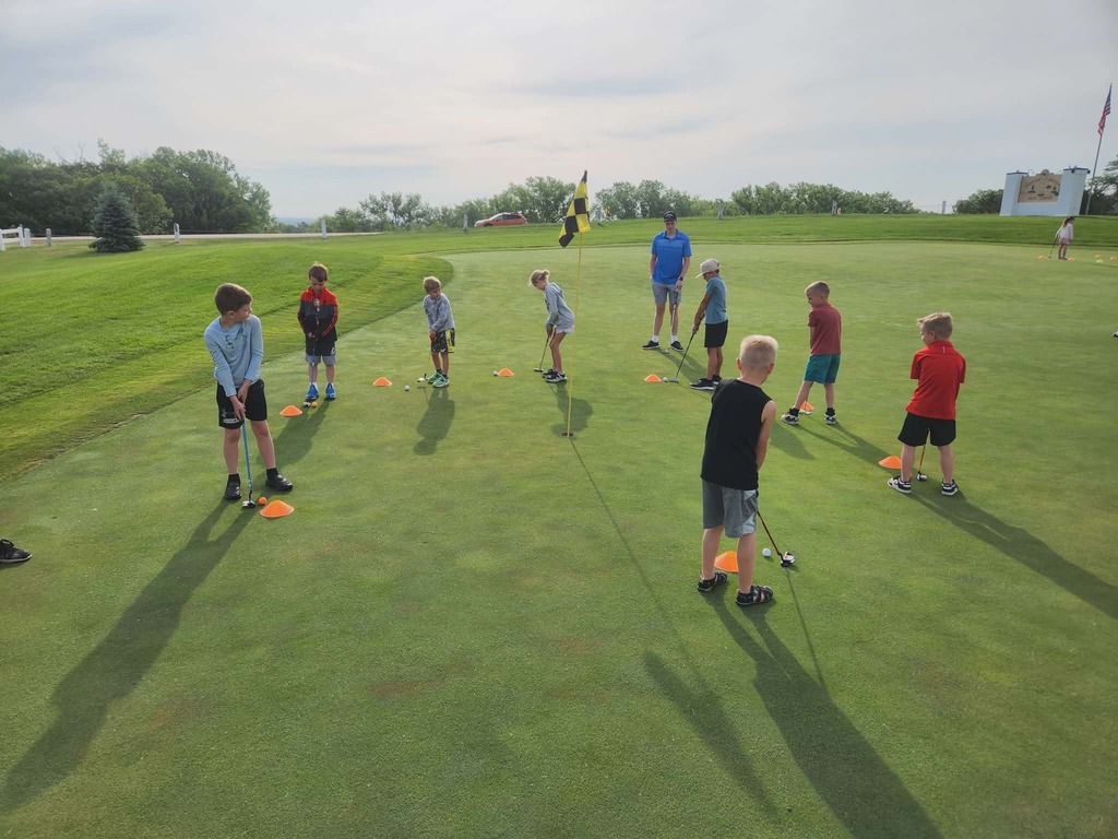 2nd grade ready to putt from different spots around the hole
