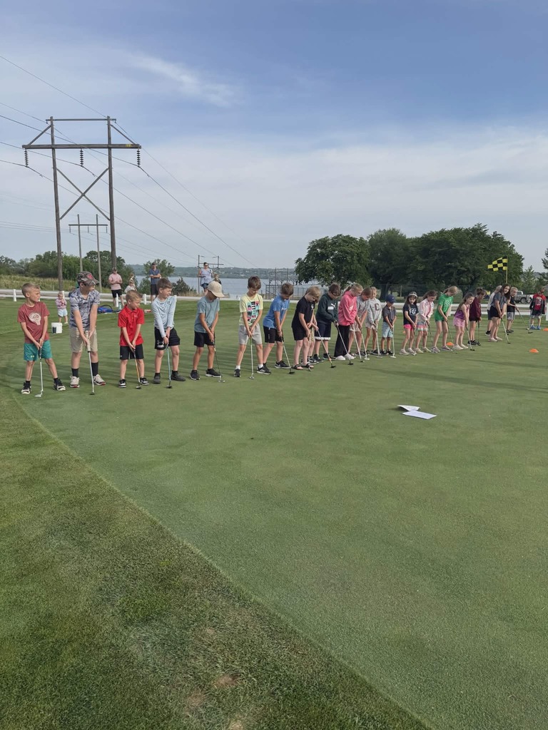 Second through fourth graders lining up to find a putter that best fits them. Photos by Breanna Jensen