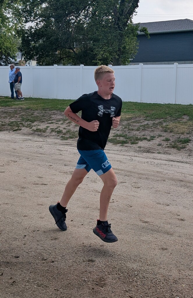 Caden Luebbe runs by.