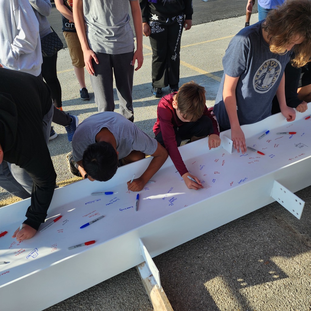 JH staff & students signing the beam