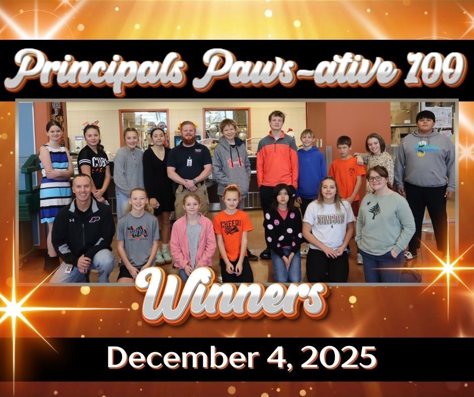 A group of students with the principal & SRO stand in the cafeteria as winners of the Principals Paws-ative 100 winners for Dec. 4.