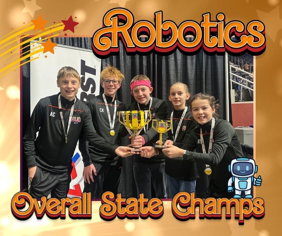 A group of five students stand holding their Wyoming State Robotics trophies