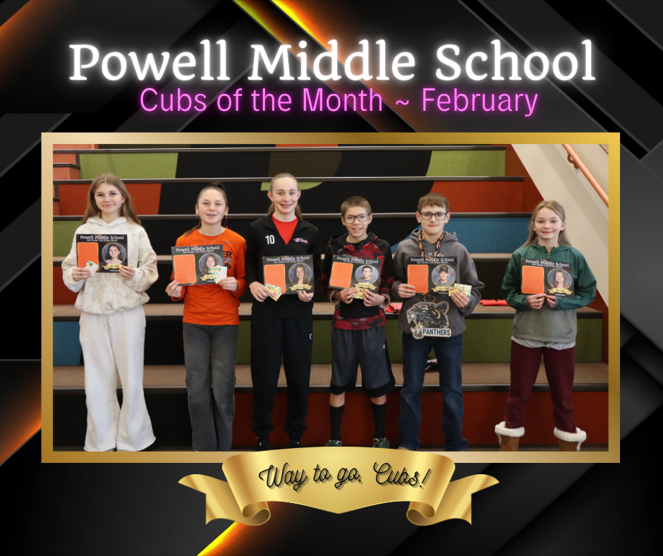 Middle School students standing in front of large stairs holding Cub of the Month certificates and gift cards.