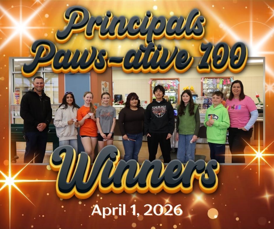 Students and staff standing in a cafeteria