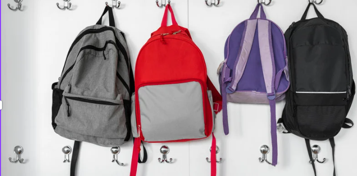 backpacks in a line